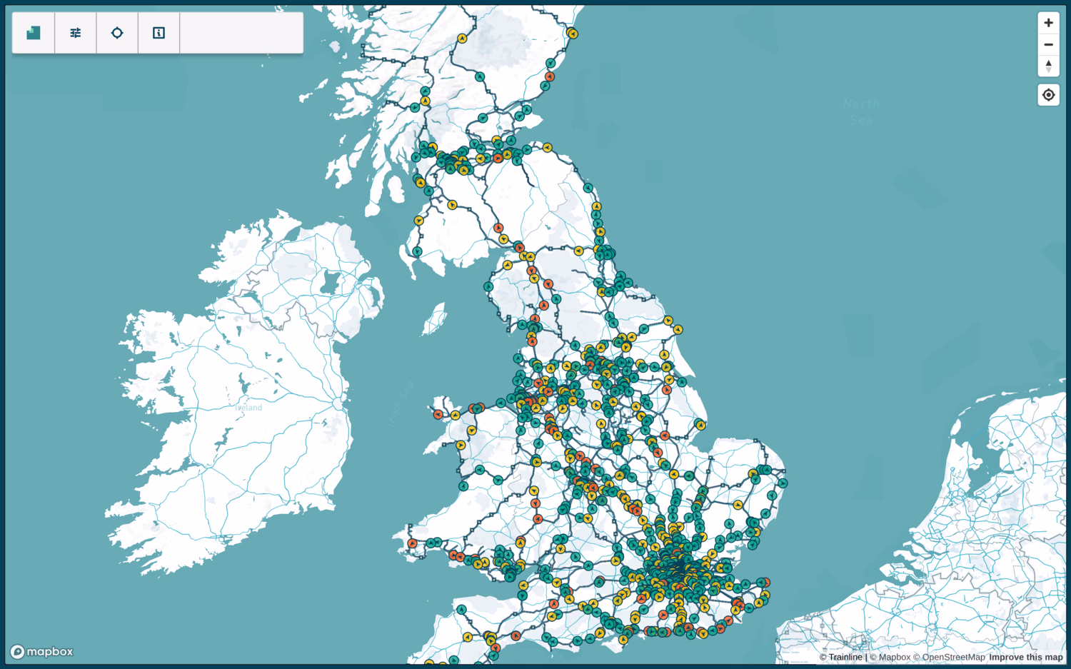 Signalbox map of Great Britain, showing all live trains and routes. Trains are arrows in circles, either green, yellow or red depending on how on time they are. There's a particularly high concentration of trains around London, and Manchester-Liverpool-Leeds.